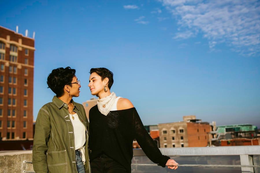 Two women together at golden hour, looking at each other