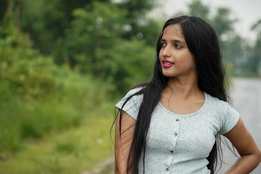 A woman outdoors, looking off into the distance